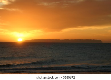 Sunset Over The Island Of Ni'ihau As Seen From A Kauai, Hawaii.