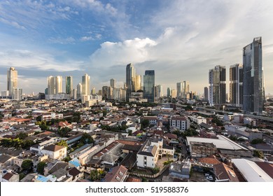 Sunset Over Jakarta Skyline Business District In Indonesia Capital City.