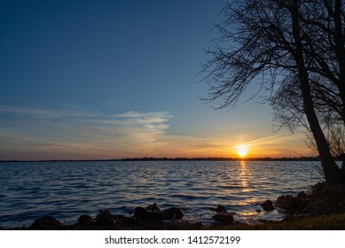 Sunset Over Lake Cadillac Michigan Water Golden Glow Sunrise