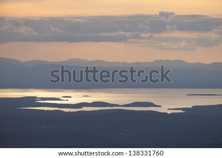 Sunset over Lake Champlain and the Adirondacks of New York from the top of Mt. Mansfield Vermont, USA
