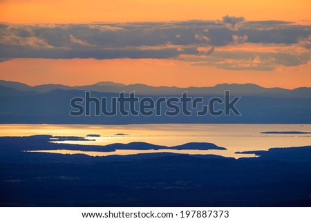 Sunset over Lake Champlain and the Adirondacks of New York from the top of Mt. Mansfield Vermont, USA