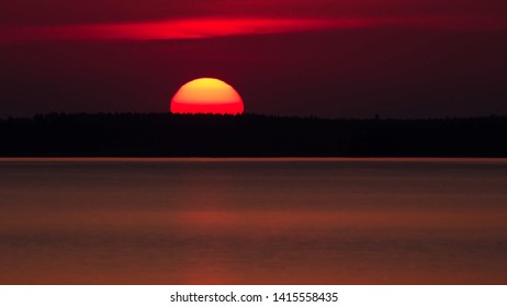 sunset over the lake in Finland - Shutterstock ID 1415558435