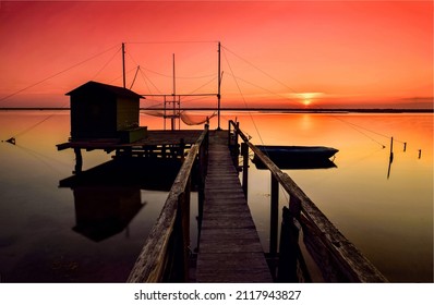 Sunset over lake pier landscape. Lake pier at sunset. Sunset lake pier. Sunset lake pier silhouette
