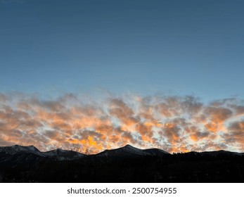 sunset over a large mountain 
