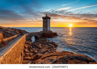 Sunset over the lighthouse at Kermorvan on the Brittany coastline near Brest
