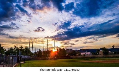 Sunset over looking a high school baseball field