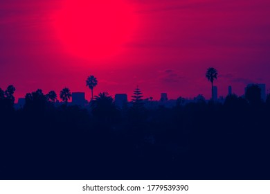 Sunset Over Los Angeles Skyline With Buildings And Palm Trees In California - Red And Blue Duotone Color Effect