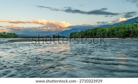 Sunset over Madre de Dios river, Manu national park, Peruvian Amazon, Cusco, Peru