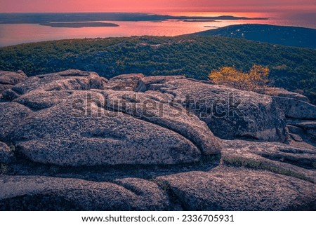 Sunset over the massive rock formations at the top of Cadillac Mountain in Bar Harbor, Maine 