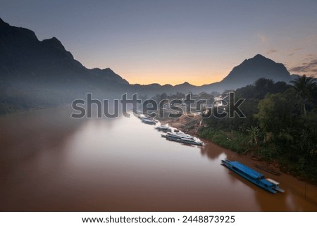 Sunset over the misty Nam Ou River at the village of Nong Khiaw, Luang Prabang Province, Northern Laos, Laos, Indochina, Southeast Asia, Asia