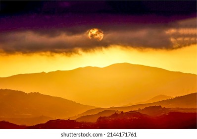 Sunset over the mountain peaks. Night fall at sunset landscape. Golden sunset landscape. Beautiful sunset landscape