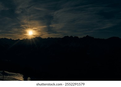 Sunset over mountain range creates dramatic silhouette against the twilight sky - Powered by Shutterstock - Get 15% off with code: PIKWIZARD15
