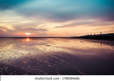 Sunset Over The Mud Flats