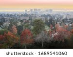 Sunset over Oakland via Mountain View Cemetery. Oakland, Alameda County, California, USA.