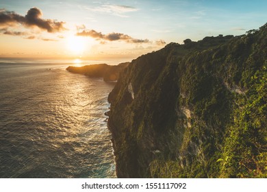 sunset over the ocean, cliff