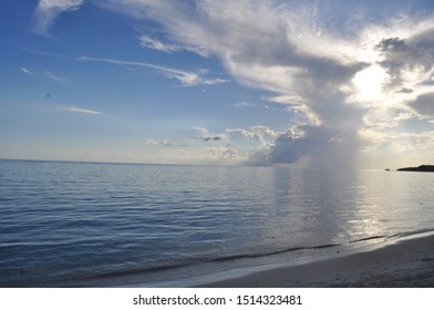 Sunset over ocean with cloud coverage