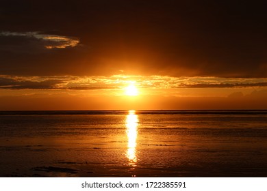 Sunset Over the Ocean with Clouds