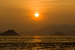 Sunset Over The Ocean. Scenic View Of Islands And Hills During Sunset. Eye Level View
