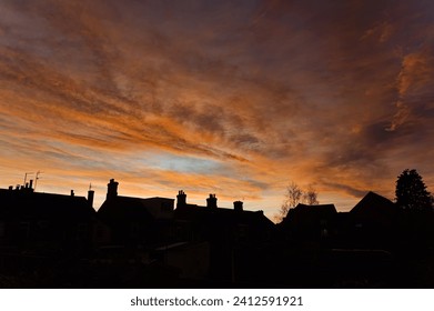 sunset over old house rooftops - Powered by Shutterstock