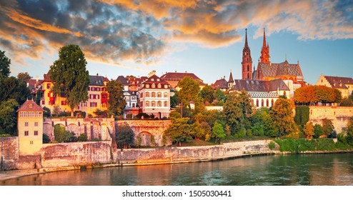 Sunset over Old Town of Basel and red stone Munster cathedral and  Rhine river, Switzerland