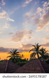 Sunset Over Palm Trees and Rooftops in Senggigi, Lombok, Indonesia
