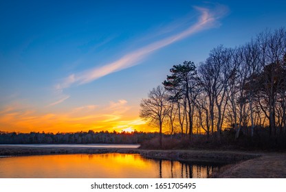 Sunset Over Peaceful Cranberry Bog In Winter On Cape Cod