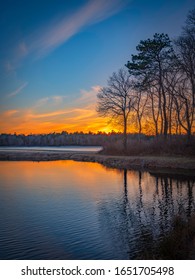 Sunset Over Peaceful Cranberry Bog In Winter On Cape Cod