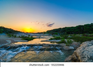 Sunset over the Pedernales River Waterfall at Pedernales State Park near Johnson City, Texas in the Texas Hill Country