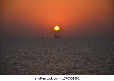 Sunset Over Persian Gulf With Oil Platform