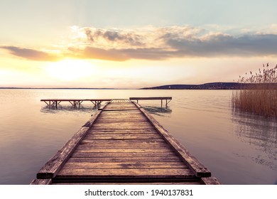 Sunset at over the pier at Lake Balaton Hungary . - Powered by Shutterstock