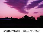 Sunset over Queanbeyan Showground and trees