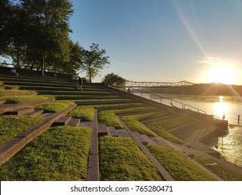Sunset over the river with bridge in the background