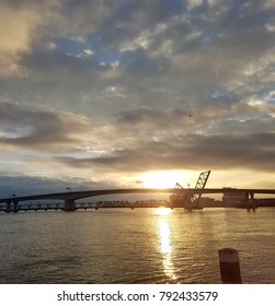 Sunset Over A River With A Drawbridge Up