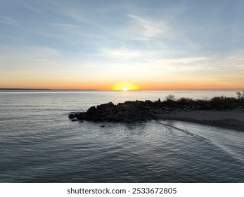 Sunset over rocks and beach