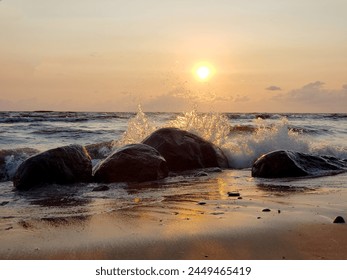 Sunset over rocky coastline, waves crashing creating mesmerizing display of power and tranquility. Vibrant sky colors reflect in calm waters, adding to serene atmosphere. - Powered by Shutterstock