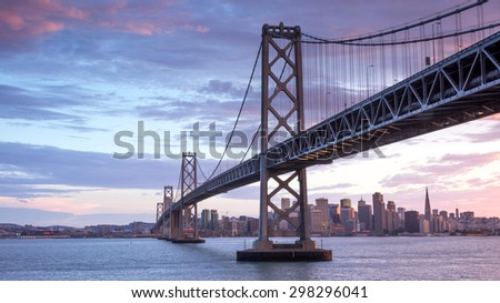 Sunset over San Francisco-Oakland Bay Bridge and San Francisco Skyline. Yerba Buena Island, San Francisco, California, USA.