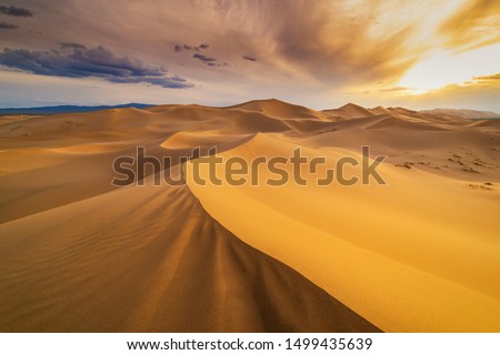 Sunset over the sand dunes in the desert. Death Valley, USA