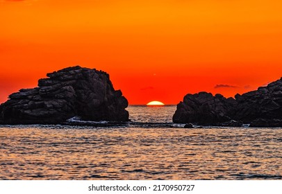 Sunset over the sea horizon. Sea rocks at sunset. Sunset sea rocks. Sundown over sea horizon - Shutterstock ID 2170950727