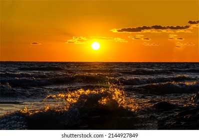 Sunset over the sea horizon. Sea horizon at sunset. Sundown over the sea horizon. Beautiful sea sunset