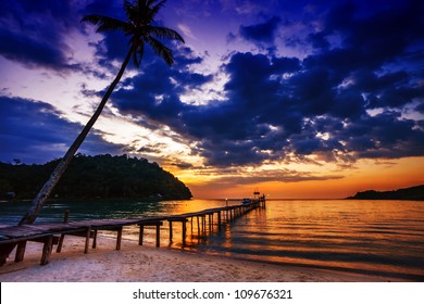 Sunset over the sea. Pier on the foreground - Powered by Shutterstock