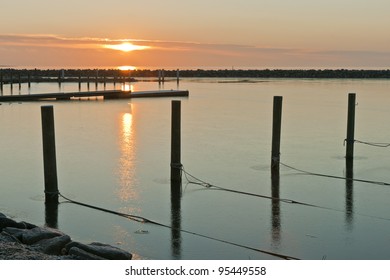 Sunset Over The Small Harbour At Hou Near Aarhus, Denmark. Winter