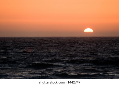 Sunset Over Stormy Seas