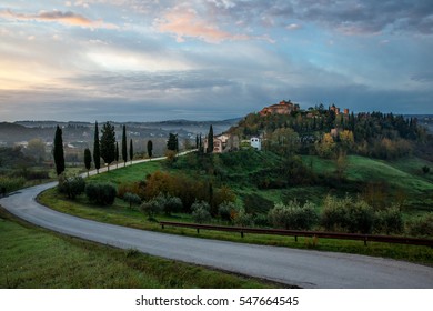 Sunset Over The Winding Road With Cypresses In Tuscany