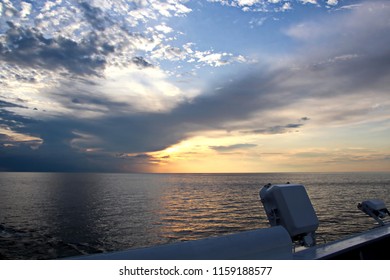 Sunset in the Pacific Ocean. Various types of sunset from the side of the ship when underway and anchored in the port. Riot of colors of the ocean, clouds and sun. - Shutterstock ID 1159188577