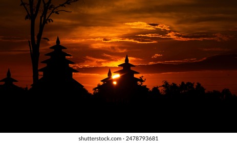 Sunset with a pagoda in the north of Thailand in the background. - Powered by Shutterstock