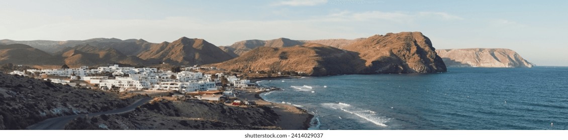 Sunset panorama of Las Negras, Negro hill and San Pedro cove, Almería, Spain. Las Negras is a small town located on the coast of Gata Cape in the Mediterranean Sea. - Powered by Shutterstock