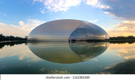 Sunset Panorama With The National Performing Arts Center In Beijing (formerly The Beijing National Grand Theater). Futuristic Design, One Of The Most Famous Landmarks Of Beijing, China 08/22/2018