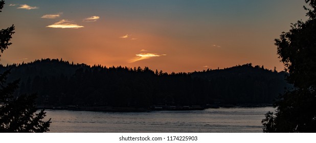 Sunset Panorama Over Lake Arrowhead In The San Bernardino Mountains, California With Copper And Blue Sky.