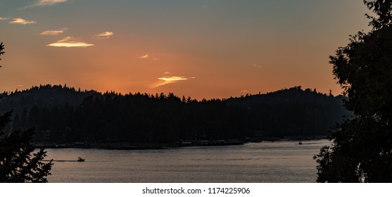 Sunset Panorama Over Lake Arrowhead In The San Bernardino Mountains, California With Copper And Blue Sky.