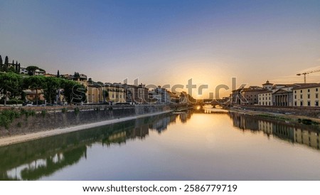 Sunset panoramic view of Florence Ponte Vecchio over Arno River in Florence , Italy. Florence architecture. One of the main landmarks in Florence. Colorful sky